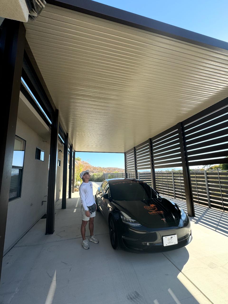 Mike inspecting a completed SunBlockers patio cover installation
